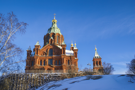 Picturesque view of the sunlit Uspenski Cathedral in Helsinkiの写真素材