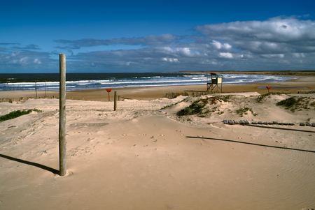 Amazing view of a lifeguard tower standing on a beach in Cabo Polonio at sunsetの写真素材