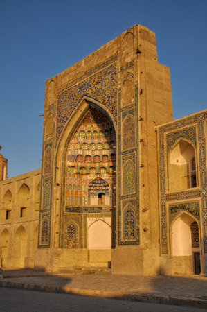 Side-view of the Abdulaziz Khan Madrassah (Museum of Wood Carving Art) in the setting sun, Uzbekistanのeditorial素材