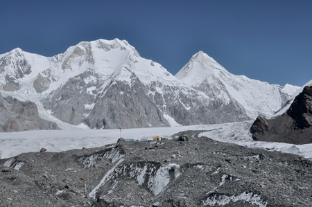 Scenic snow-covered mountain peaks around Engilchek glacier in Tian Shan mountain range in Kyrgyzstanの写真素材