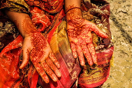 Traditional henna on brides hands on wedding in Bangladeshの写真素材