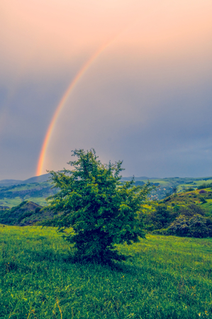 Rainbow over green landscape of mountainous Karabakhの写真素材
