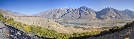 Scenic panorama of valley on arid landscape in Tajikistan on sunny dayの写真素材
