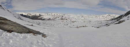 Scenic panorama of snowy landscape near Trolltunga in Norwayの写真素材