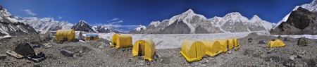 Scenic panorama of tents on Engilchek glacier in picturesque Tian Shan mountain range in Kyrgyzstanの写真素材