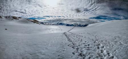 Scenic panorama of snowy landscape near Trolltunga in Norwayの写真素材