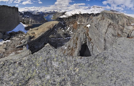 Scenic view of Trolltunga rock  and the surrounding mountains in Norwayの写真素材