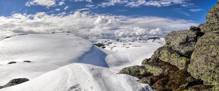 Scenic panorama of snowy landscape near Trolltunga in Norwayの写真素材