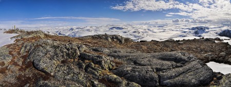 Scenic panorama of snowy landscape near Trolltunga in Norwayの写真素材