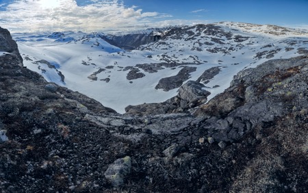 Scenic panorama of snowy landscape near Trolltunga in Norwayの写真素材