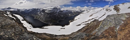 Scenic panorama of snowy landscape near Trolltunga in Norwayの写真素材