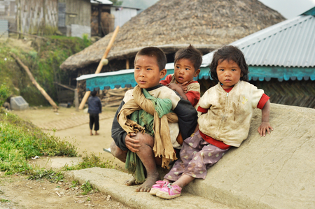 Nagaland, India - March 2012: Poor children on the street of village in Nagaland, remote region of India. Documentary editorial.のeditorial素材