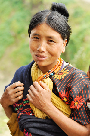 Nagaland, India - March 2012: Pretty young woman in traditional dress in Nagaland, remote region of India. Documentary editorial.のeditorial素材