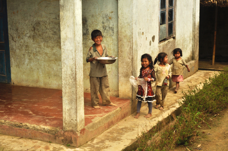 Nagaland, India - March 2012: Group of small happy children in village of Phuktong in Nagaland, remote region in India. Documentary editorial.のeditorial素材