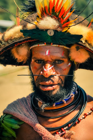 Wabag, Papua New Guinea - circa August 2015: Native man during traditional Enga cultural show in Wabag, Papua New Guinea. Documentary editorial.のeditorial素材
