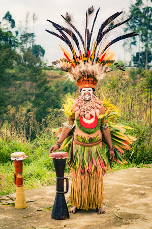 Hagen show, Papua New Guinea - circa August 2015: Native man dressed in complex colourful costume during Hagen show, Papua New Guinea. Documentary editorial.のeditorial素材