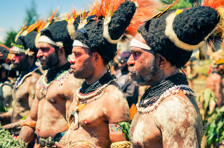 Wabag, Papua New Guinea - circa August 2015: Native half-naked men during traditional Enga cultural...