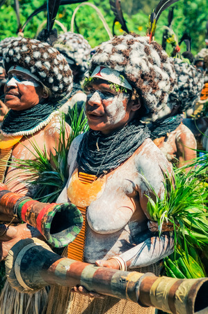 Wabag, Papua New Guinea - circa August 2015: Native half-naked woman during Enga cultural show in Wabag, Papua New Guinea. Documentary editorial.のeditorial素材