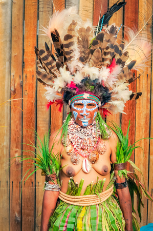 Hagen show, Papua New Guinea - circa August 2015: Native half-naked woman dressed in traditional costume during Hagen show, Papua New Guinea. Documentary editorial.のeditorial素材