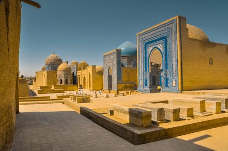 Large square with typical blue ornaments on walls of houses made of bricks in Samarkand in Uzbekistan.のeditorial素材