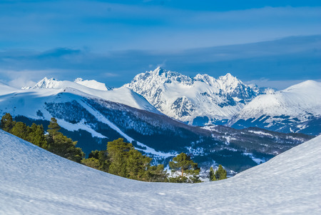 Photo of countryside with mountains in distance covered in snow during winter in Volda in Norway.の写真素材