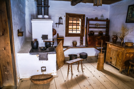 Photo of old room with white walls in house of Slovak ancestors with typical historical equipment in...