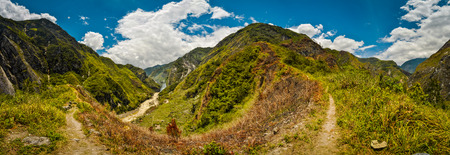 Panoramic view of mountains with rich greenery in Dani circuit near Wamena, Papua, Indonesia. In this region, one can only meet people from isolated local tribes.の写真素材