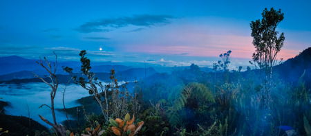 Photo of mountains and greenery covered by evening fog in Digne in Kubor range, Papua New Guinea. In this region, one can only meet people from isolated local tribes.の写真素材