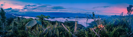 Darkness and evening fog above mountains in Digne in Kubor range, Papua New Guinea. In this region, one can only meet people from isolated local tribes.の写真素材