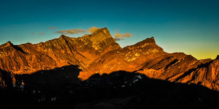 Panoramic photo of mountains in morning sunlight at sunrise in Trikora, Papua, Indonesia. This is...