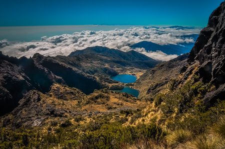 Lake and mountains covered by morning fog on Mount Wilhelm, Papua New Guinea. This is very remote location, rarely visited by people.の写真素材