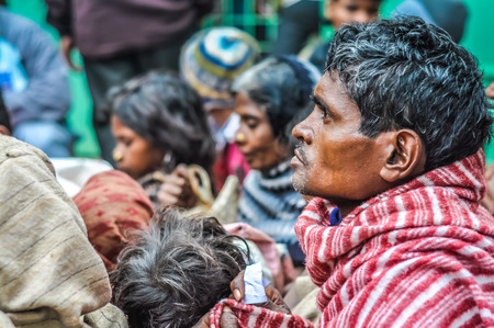 Bohdgaya, Bihar - circa January 2012: Native man listens to ceremony at school visit in Bohdgaya, Bihar. Documentary editorial.のeditorial素材
