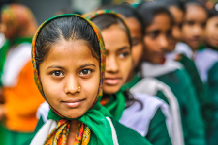 Bohdgaya, Bihar - circa January 2012: Young girls in school uniforms stand in row at school in Bohdgaya, Bihar. Documentary editorial.のeditorial素材