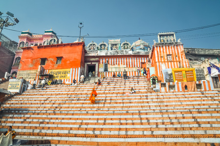Varanasi, Uttar Pradesh - circa January 2012: Photo of people on stairs in front of building in Varanasi, Uttar Pradesh. Documentary editorial.のeditorial素材