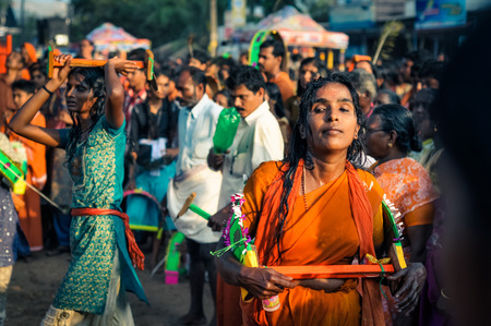 Alleppey, Kerala - circa February 2012: Photo of people during crazy festival in Alleppey, Kerala. Women in front wear colourful clothes and play traditional games. Documentary editorial.のeditorial素材