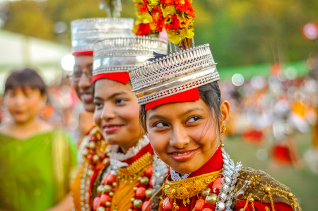 Shillong, Meghalaya - circa April 2012: Smiling girls in traditional costumes with large beads and crowns on their heads at Shad Suk Mynsiem Festival in Shillong, Meghalaya. Documentary editorial.のeditorial素材