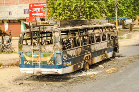 Nepal - circa May 2012: Bus burned in Nepal general strike. Documentary editorial.のeditorial素材
