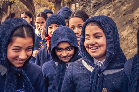 Keylong, Himachal Pradesh - circa November 2011: Young girls wear blue school uniform in Keylong, Himachal Pradesh. Documentary editorial.のeditorial素材