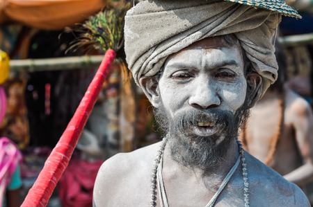 Ganga Sagar, West Bengal - circa January 2012: Man with beard and turban is covered in white powder in Ganga Sagar, West Bengal. Documentary editorial.のeditorial素材