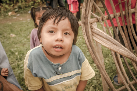 Villa Alcira, Bolivia - circa June 2009: Young native boy poses at Villa Alcira, Bolivia. Documentary editorial.のeditorial素材