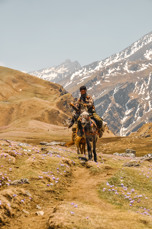 Dolpo, Nepal - circa May 2012: Photo of native man on horse in beautiful mountainous region of Dolpo, Nepal. Documentary editorial.のeditorial素材