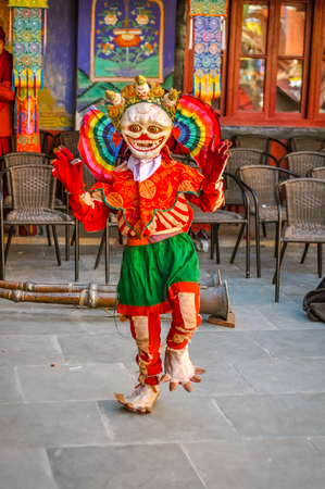 Thiksey, Ladakh - circa November 2011: Person in colourful mask poses during Thiksey festival, Ladakh. Documentary editorial.のeditorial素材