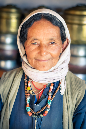 Thiksey, Ladakh - circa November 2011: Older pretty woman with kind smile in Thiksey, Ladakh. Documentary editorial.のeditorial素材