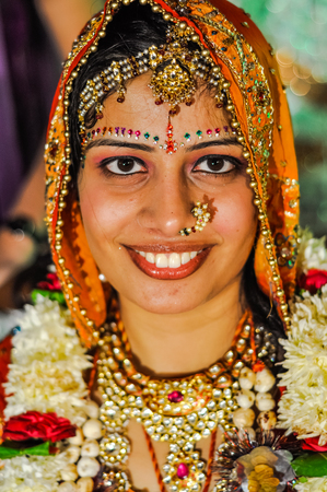 Bikaner, Rajasthan - circa December 2011: Photo of smiling bride wearing traditional jewellery during wedding ceremony in Bikaner, Rajasthan. Documentary editorial.のeditorial素材