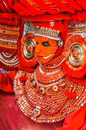Thottada, south of Kannur, Kerala - circa January 2012: Dancer dressed in beautiful costume during Theyyam in Thottada, south of Kannur, Kerala. Documentary editorial.のeditorial素材