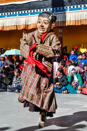 Thiksey, Ladakh - circa November 2011: Man in mask dances at Thiksey festival, Ladakh. Documentary editorial.のeditorial素材
