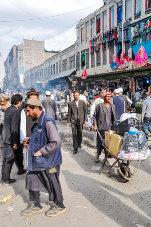 Kabul, Afghanistan - circa October 2011: Native people do shopping at marketplace in Old town, old city part in Kabul. Documentary editorial.のeditorial素材