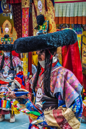 Thiksey, Ladakh - circa November 2011: Man in traditional costume poses during ceremony at Thiksey festival, Ladakh. Documentary editorial.のeditorial素材
