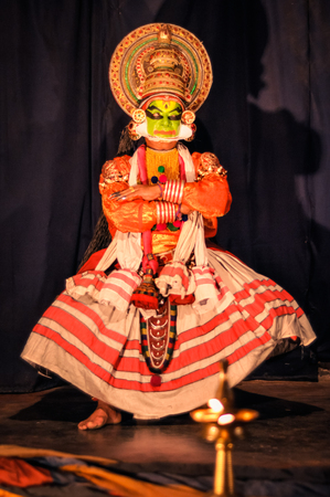 Ernakulam, Kerala - circa February 2012: Performer in colourful costume of character and artistic make-up dances Kathakali at See India Foundation, Ernakulum, Kerala. Documentary editorial.のeditorial素材