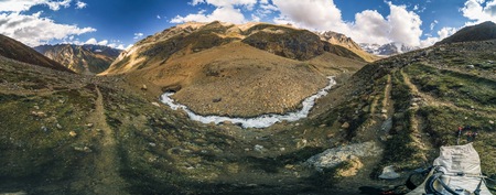 Panorama of mountains in Kashmir with stream coming down the valley.の写真素材